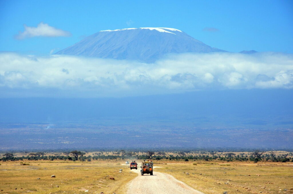 Elephants on a Tsavo East and Amboseli lodge safari beneath Kilimanjaro